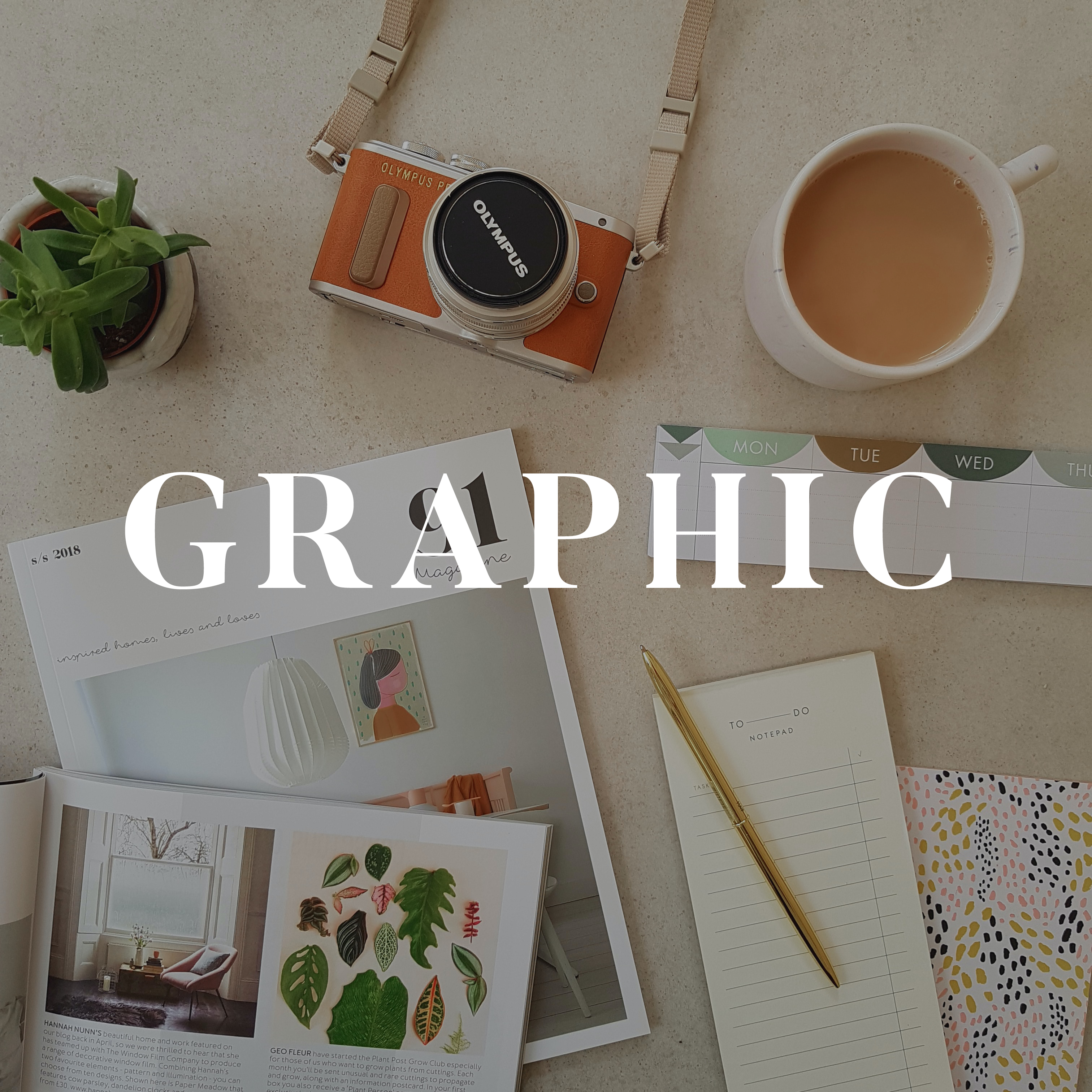 Image of magazine, notebook, camera, and coffee that leads to graphic designs I've made